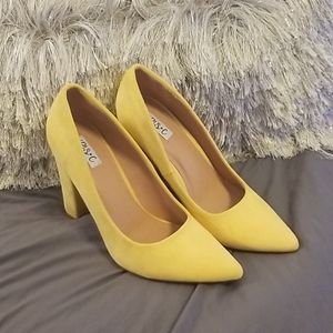 Yellow suede pumps